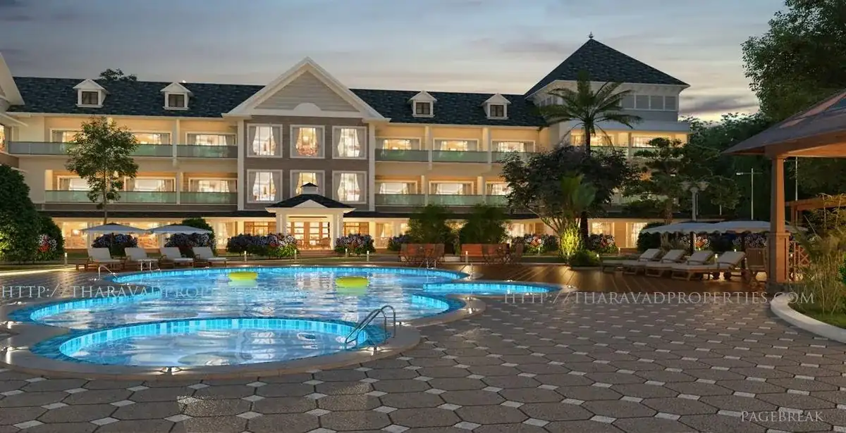 Resort building and swimming pool at dusk